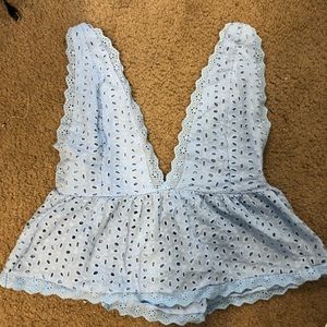 A light blue v cut tank